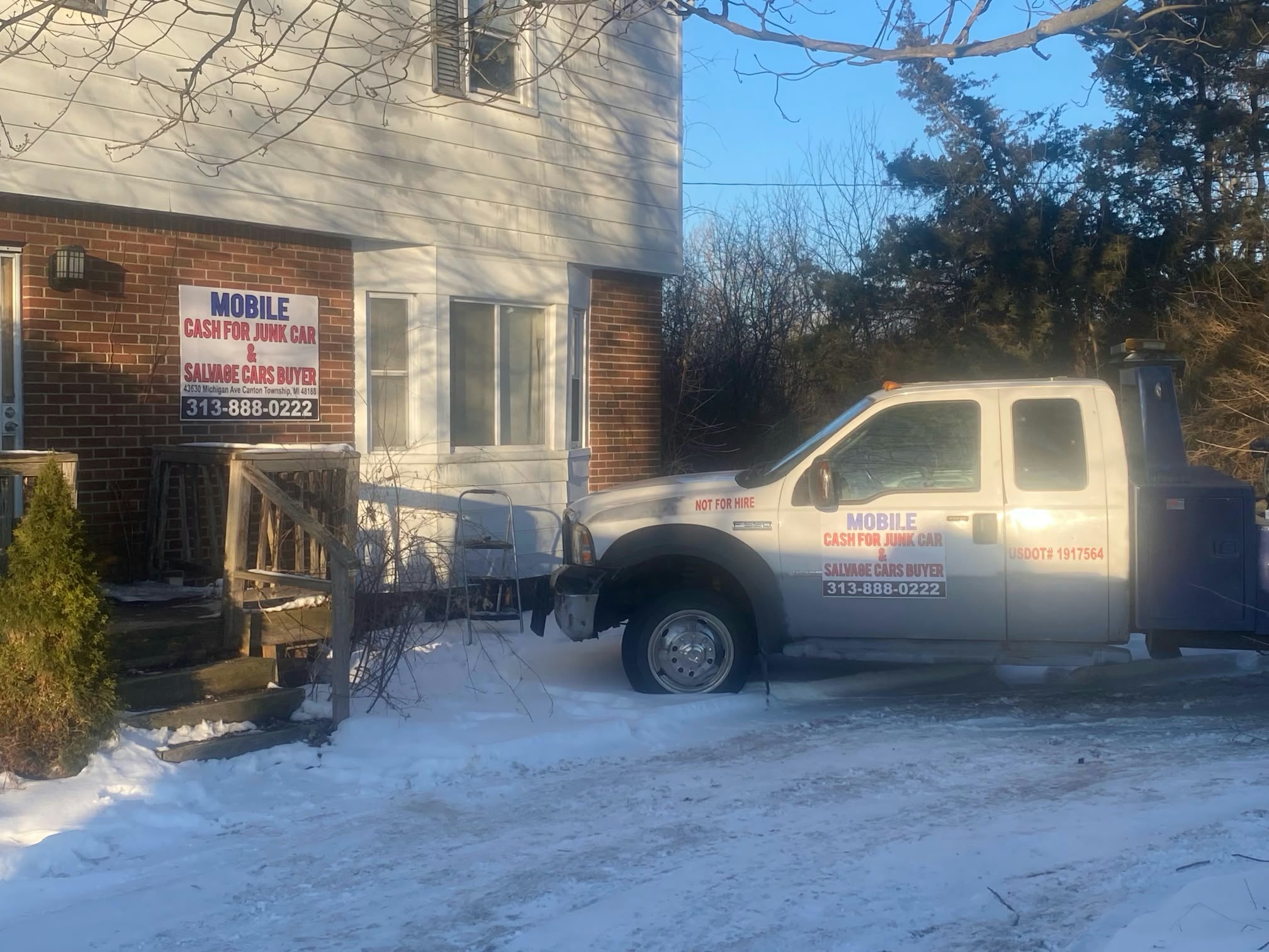 Mobile Cash for Junk Cars tow truck outside its Canton location